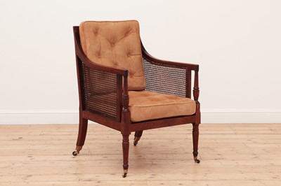 Lot 622 - A George III mahogany bergère library chair