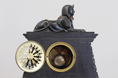 Lot 455 - A green and black marble Egyptian Revival clock garniture