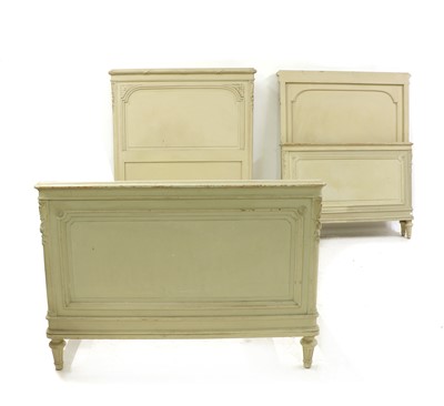 Lot 460 - A pair of Louis XVI style painted single bedsteads