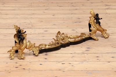 Lot 768 - A pair of rococo revival gilt ormolu chenets