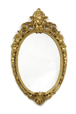 Lot 408 - A French Empire style gilt brass oval wall mirror