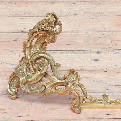 Lot 786 - A pair of Louis XV-style ormolu chenet