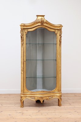 Lot 766 - A French transitional-style giltwood corner vitrine