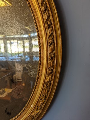 Lot 602 - A gilt-framed oval mirror
