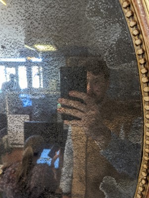 Lot 602 - A gilt-framed oval mirror