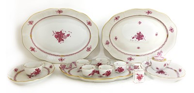 Lot 578 - A porcelain 'Apponyi Purple' part dinner service by Herend