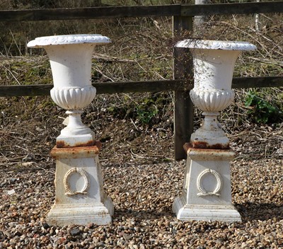 Lot 498 - A pair of cast iron campana urns