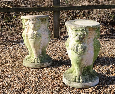 Lot 532 - A pair of reconstituted stone lion pedestals