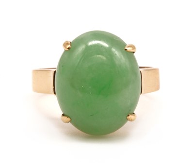 Lot 154 - A gold single stone dyed jade ring