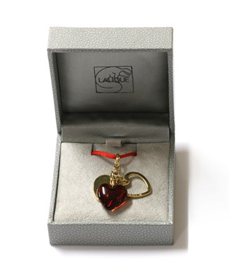 Lot 102 - A Lalique 'Heart Love' three charm pendant