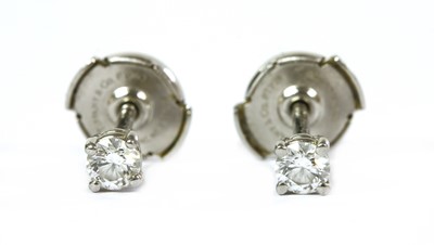 Lot 189 - A pair of platinum single stone diamond earrings, by Tiffany & Co.