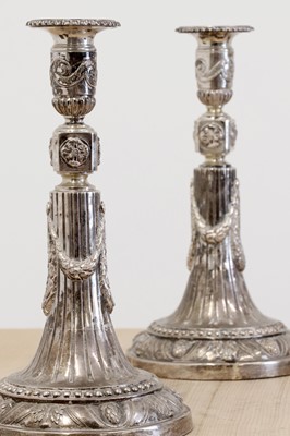 Lot 582 - A set of four German silver candlesticks