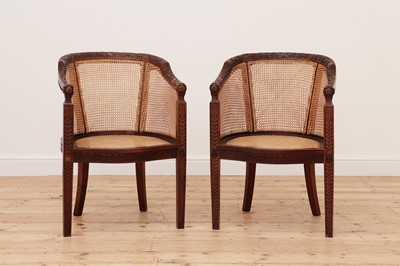 Lot 682 - A pair of carved walnut bergère tub chairs