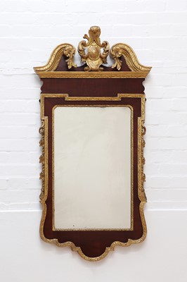 Lot 117 - A George II-style walnut and parcel-gilt pier mirror