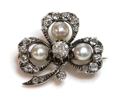 Lot 61 - A Victorian diamond and pearl set shamrock brooch, c.1890