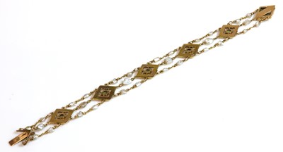 Lot 120 - An Edwardian peridot and freshwater pearl bracelet, c.1905