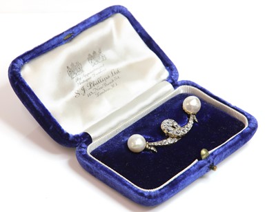 Lot 87 - A cased Victorian diamond and pearl set ribbon brooch