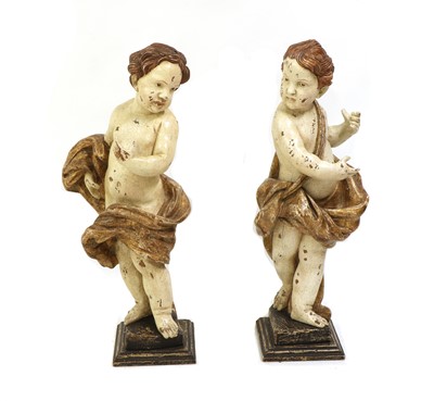 Lot 130 - A pair of carved wood cherubs