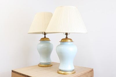Lot 719 - A pair of Chinese-style powder-blue glass table lamps