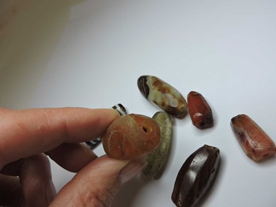 Lot 158 - A Chinese agate Dzi bead
