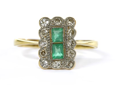 Lot 229 - A gold emerald and diamond cluster ring