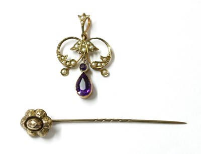 Lot 371 - An Edwardian gold amethyst and split pearl pendant