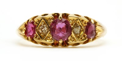 Lot 26 - A gold ruby and diamond five stone ring