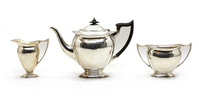 Lot 11A - A George III style three piece silver tea set