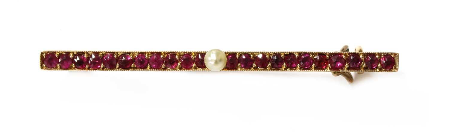 Lot 23 - A Continental gold pearl and ruby bar brooch