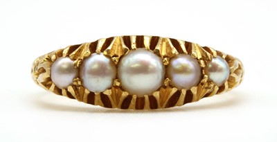Lot 13 - An Edwardian 18ct gold five stone split pearl ring