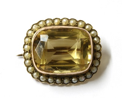 Lot 18 - A gold citrine and split pearl cluster brooch