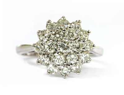 Lot 198 - An 18ct white gold three tier diamond cluster ring