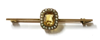 Lot 17 - A gold citrine and split pearl brooch