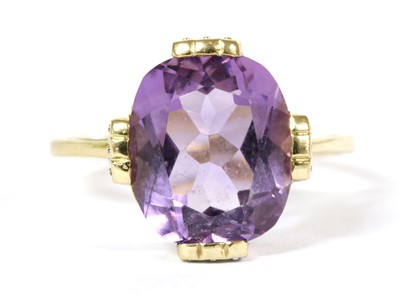 Lot 303 - A 9ct gold amethyst and diamond ring