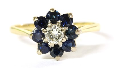 Lot 260 - A gold diamond and sapphire cluster ring