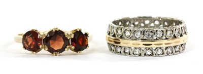 Lot 384 - A 9ct gold three stone garnet ring