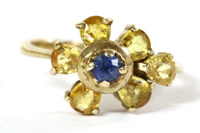 Lot 275 - A 9ct gold sapphire and yellow sapphire cluster ring