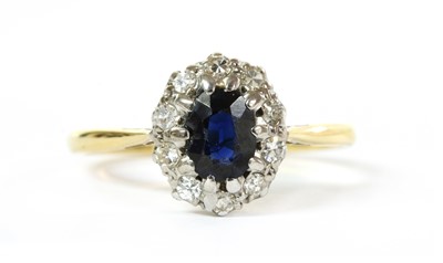 Lot 265 - A gold sapphire and diamond cluster ring