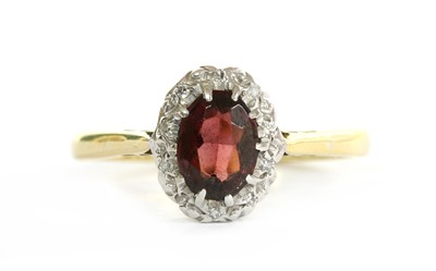 Lot 208 - A gold garnet and diamond cluster ring