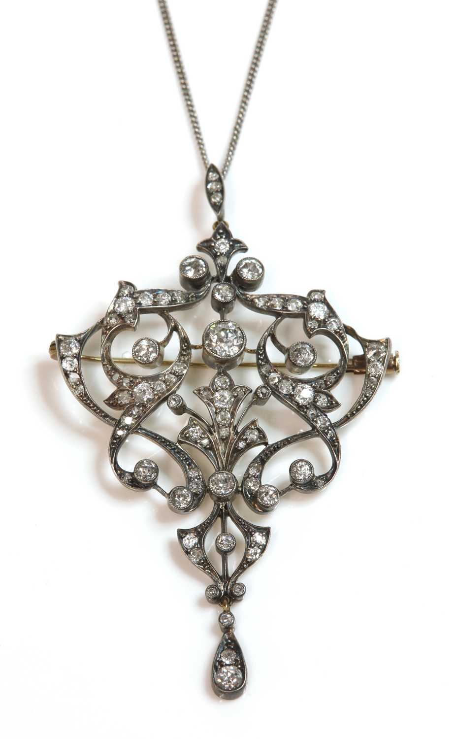 Lot 88 - A late Victorian diamond set cartouche shaped brooch/pendant, c.1890