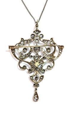 Lot 88 - A late Victorian diamond set cartouche shaped brooch/pendant, c.1890
