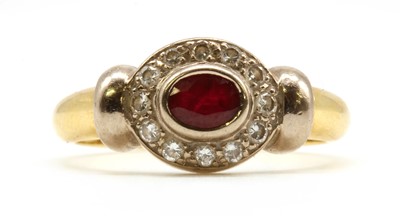 Lot 106 - A gold ruby and diamond cluster ring