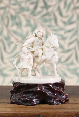 Lot 432 - A carved ivory samurai warrior group
