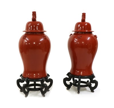 Lot 189 - A pair of large Chinese-style red vases and covers