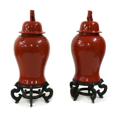 Lot 189 - A pair of large Chinese-style red vases and covers