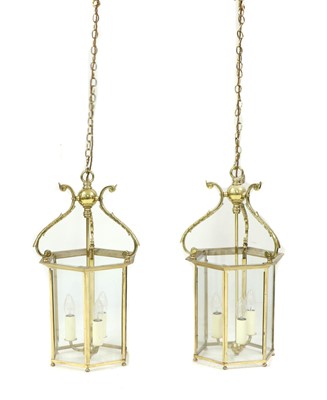 Lot 483 - A pair of George III-style brass hall lanterns