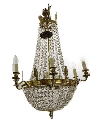 Lot 480 - A French Empire-style cut glass and brass chandelier