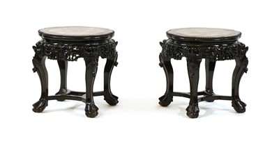 Lot 497 - A pair of marble topped stands