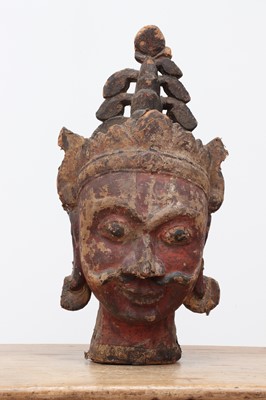 Lot 521 - A carved wooden, canvas and polychrome-decorated puppet head