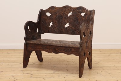 Lot 507 - A carved beech settle